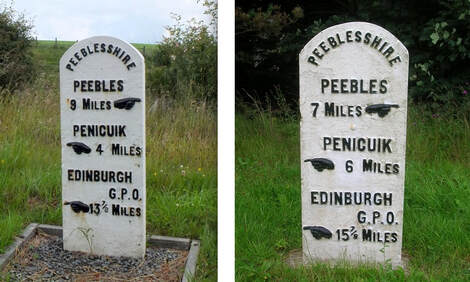 Photo showing two milestones indicating distances in miles to Peebles, Penicuik and Edinburgh general post office.
